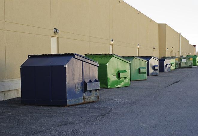 dumpsters lined up for use on busy construction site in Bald Eagle